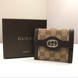 Clearing out closet for remodel. Beautiful NWT Gucci Billfold Wallet.